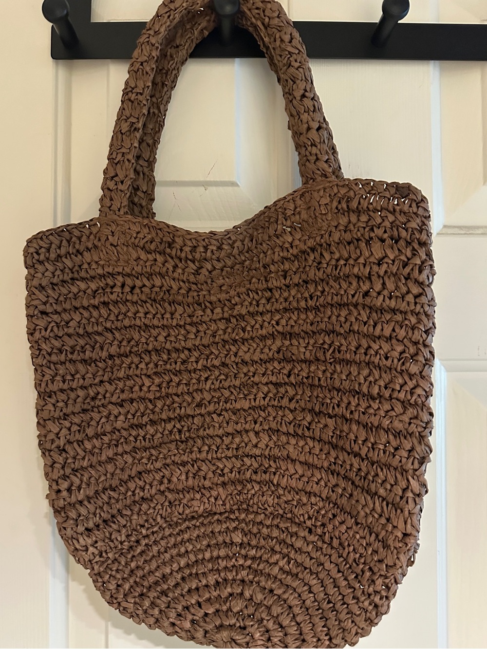 NWOT attached.  Never carried. LOFT chocolate brown strawlike bag
